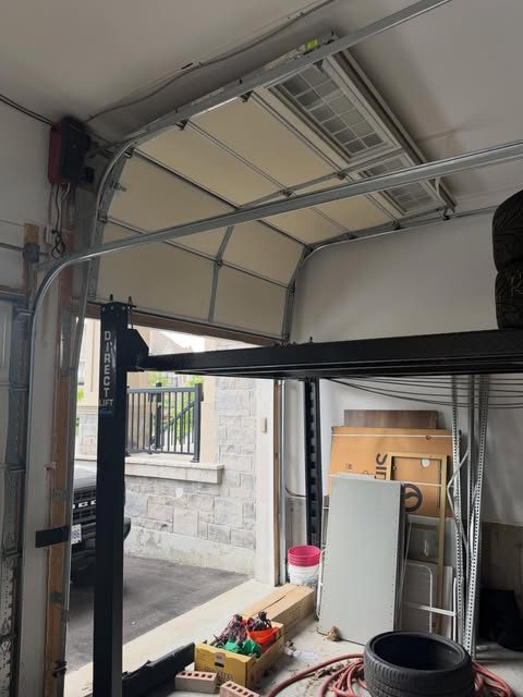 Garage door tracks and opener installed overhead